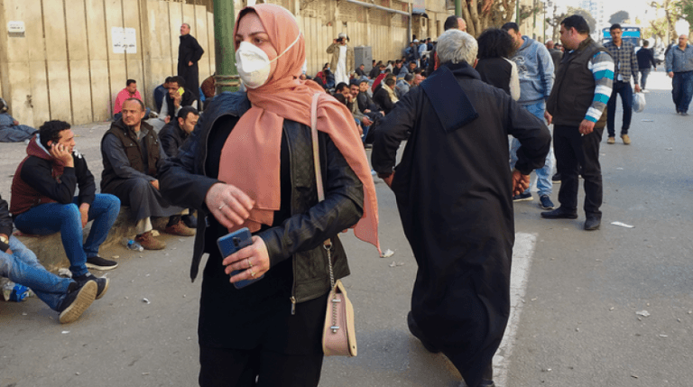 egyptians_gather_in_front_of_the_central_public_health_laboratories_in_downtown_cairo_as_they_wait_to_get_tested_for_the_coronavirus_covid-19_on_march_8_2020._afp.png