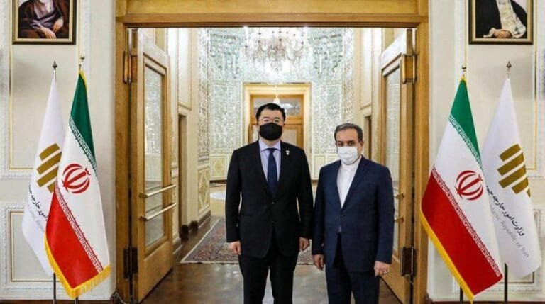 irans_deputy_foreign_minister_abbas_araghchi_right_and_his_south_korean_counterpart_choi_jong_kun_pose_for_a_photo_prior_to_a_meeting_in_tehran_iran_jan._10_2021._iran_foreign_ministry_via_ap.jpg
