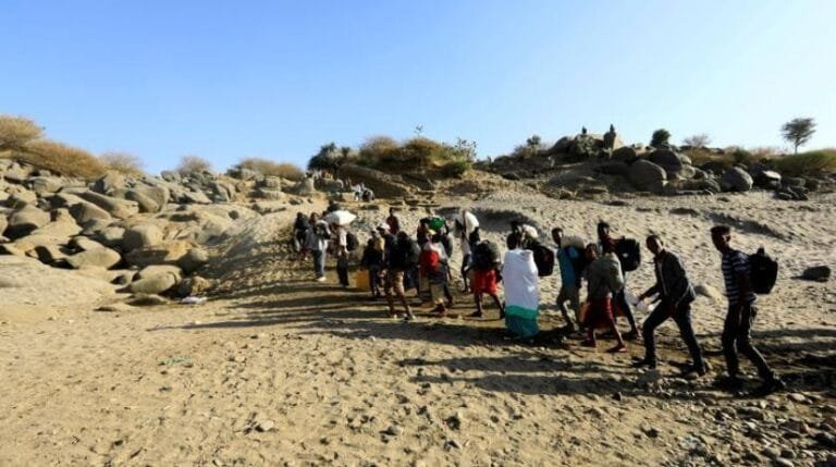 ethiopians_who_fled_the_ongoing_fighting_in_tigray_region_carry_their_belongings_on_the_sudan-ethiopia_border_in_hamdayet_village_in_eastern_kassala_state_sudan._reuters_file_photo.jpeg